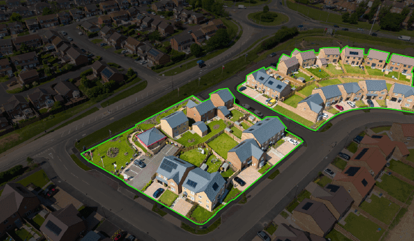 An overhead view of a neighborhood illustrating a geofence around houses