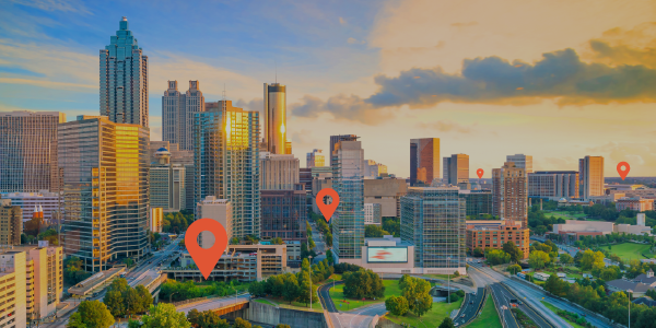 Photo of a city skyline with location pins