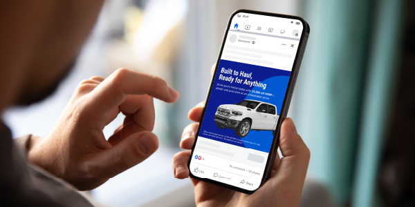 Person looking at a car ad on their phone