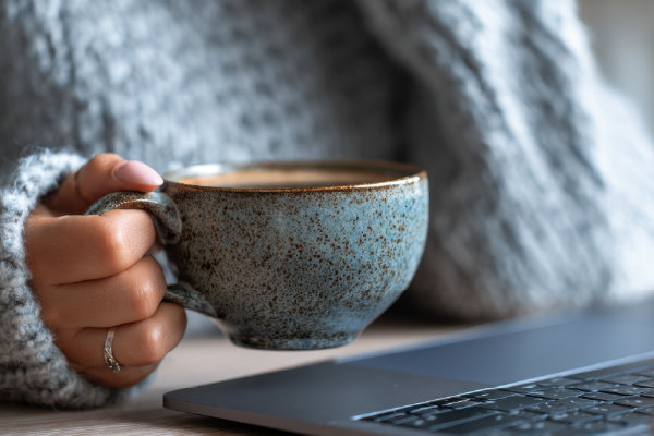 Someone holding a warm coffee mug