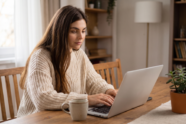 Consumer researching holiday deals online, illustrating digital shopping behavior for holiday retail advertising campaigns